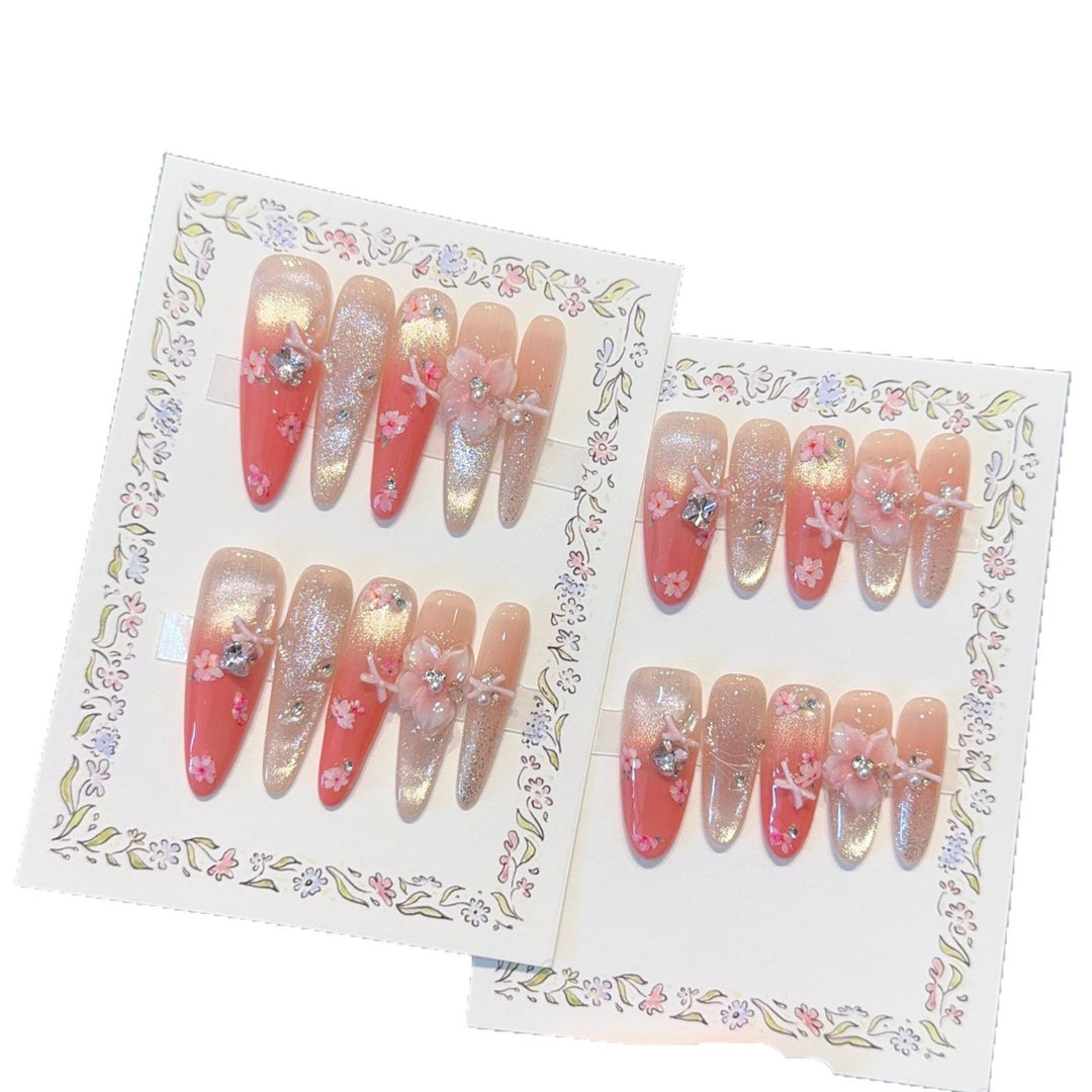 Artificial nails with floral embellishments and glitter effects Stornfield