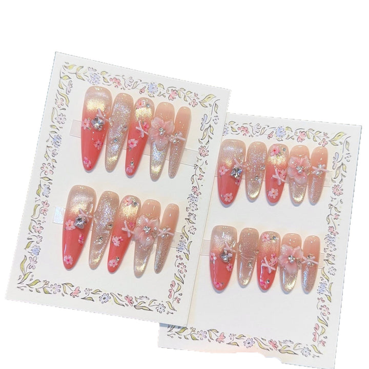 Artificial nails with floral embellishments and glitter effects Stornfield