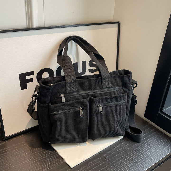 Durable shoulder bag with multiple compartments Stornfield