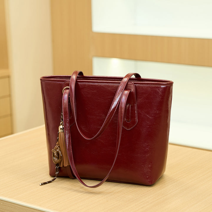 Elegant Structured Handbag with Tassel Detail