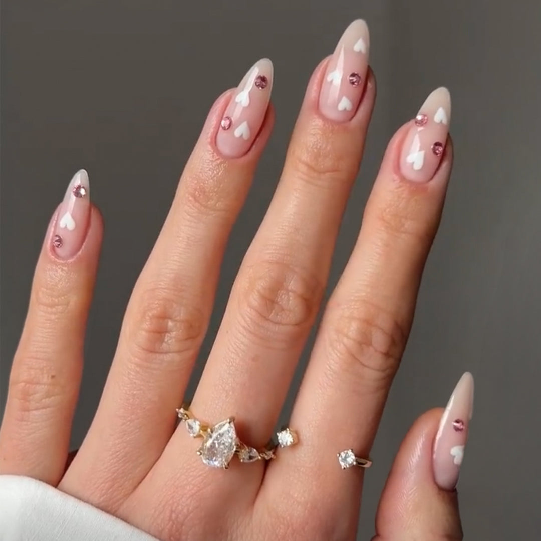 Decorative artificial nails with heart motif and rhinestones Stornfield