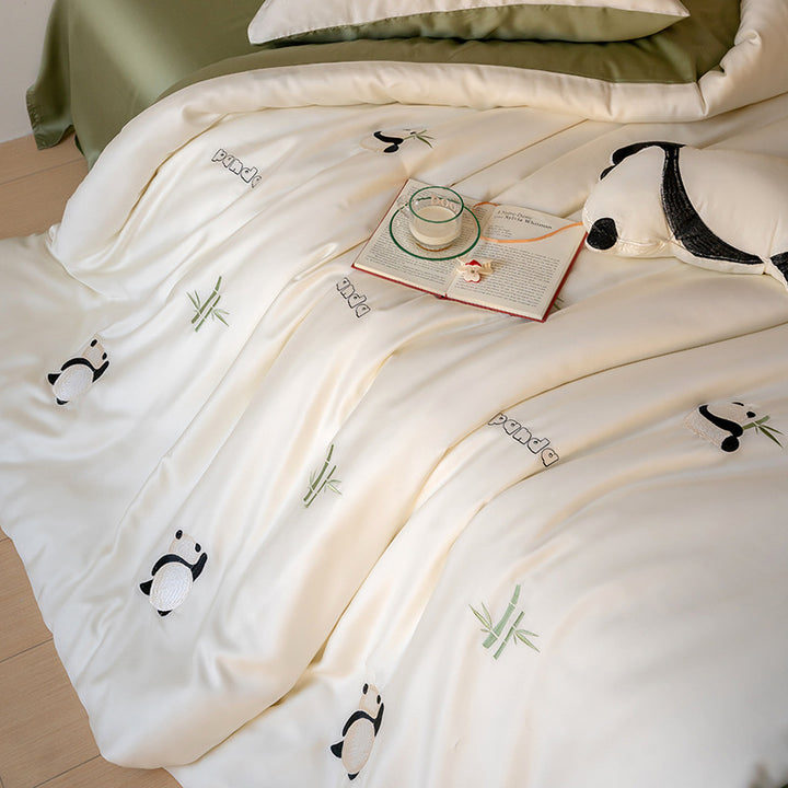 Bedding set with embroidered hot air balloon motifs and silky satin finish