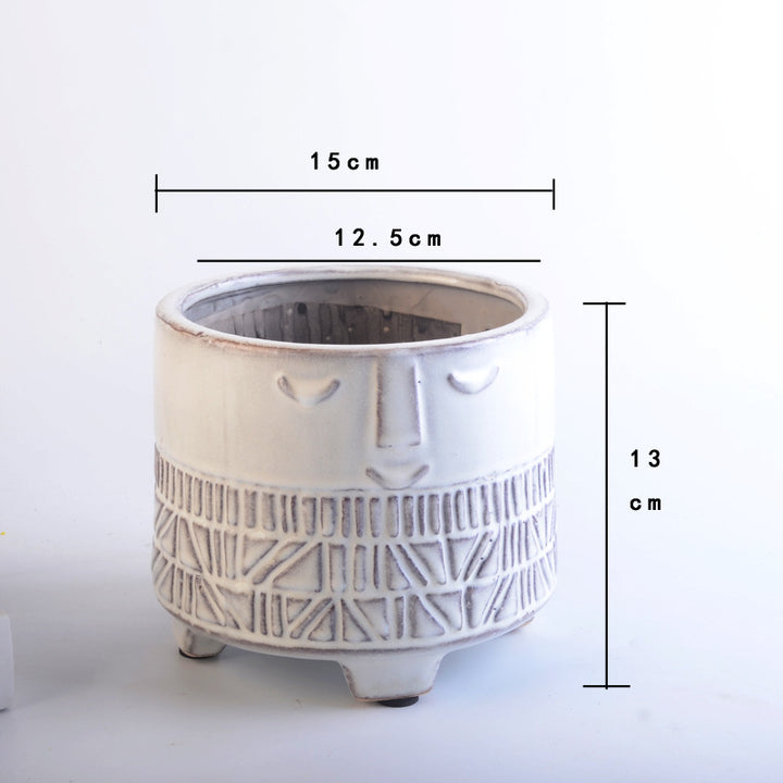 Decorative plant pot with facial features Stornfield