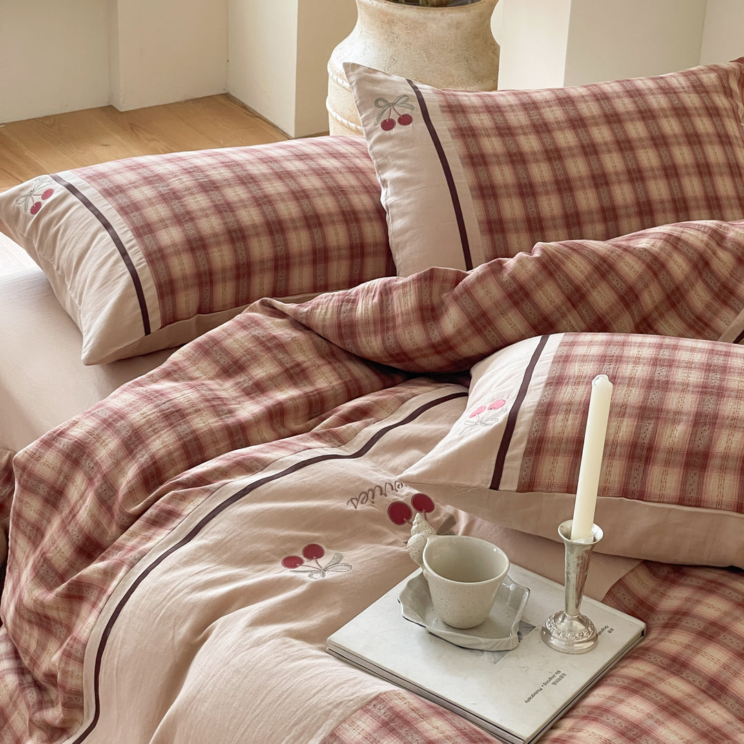 Luxurious cotton bedding set with check pattern and embroidered floral appliqués