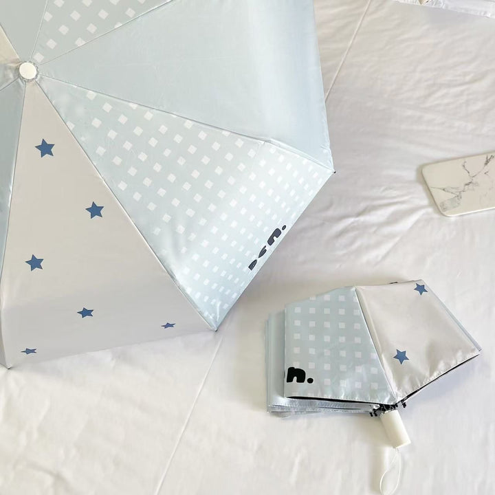 Women's folding umbrella with unique star pattern and practical carrying bag Stornfield