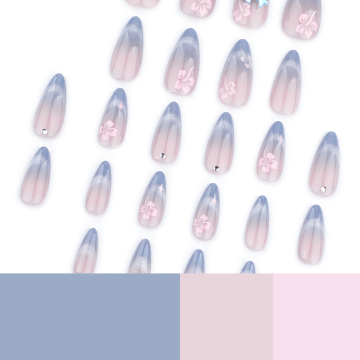 Artful nail extensions with elegant ombré design and floral accents Stornfield