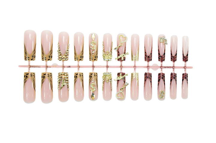 Artificial nail set with elegant golden and animal decorations Stornfield