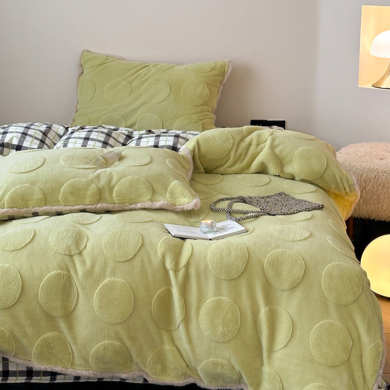 Plush bedding set with embossed floral relief and teddy trim