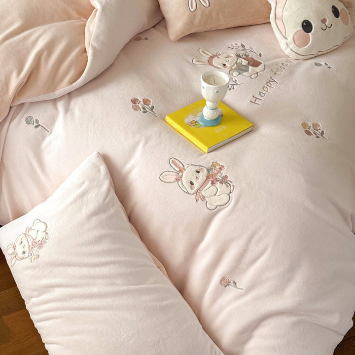 Cute children's bedding set made of soft cotton terry with embroidered cat appliqués and cuddly plush pillow.