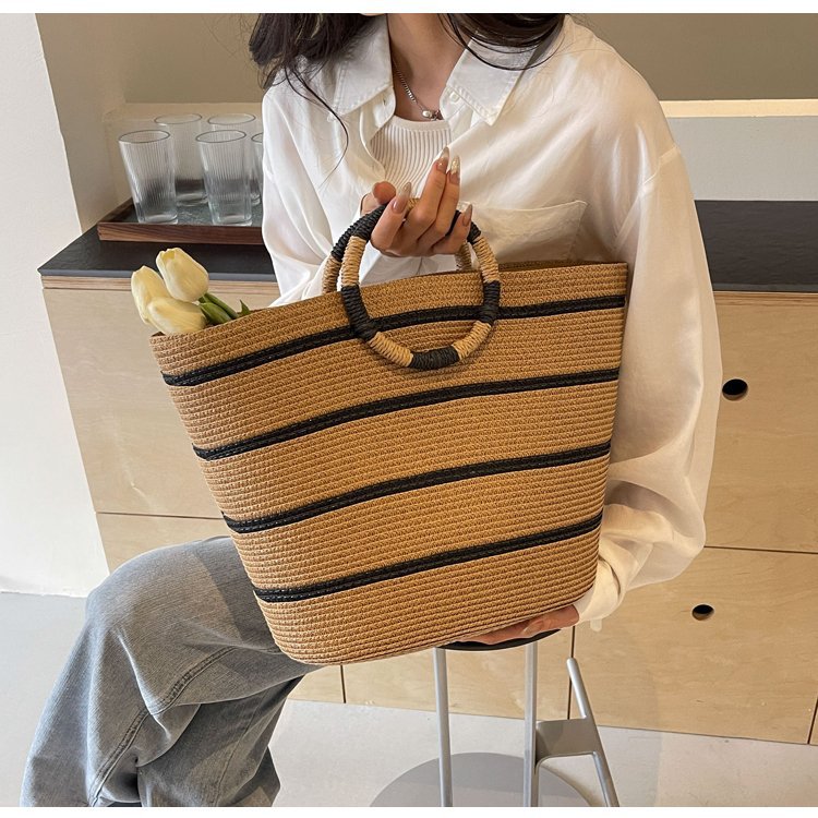 Generous straw shopper with stylish ring handle Stornfield