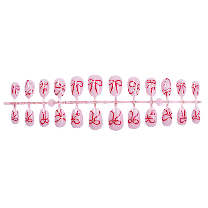 Artificial nail design with bow motifs Stornfield