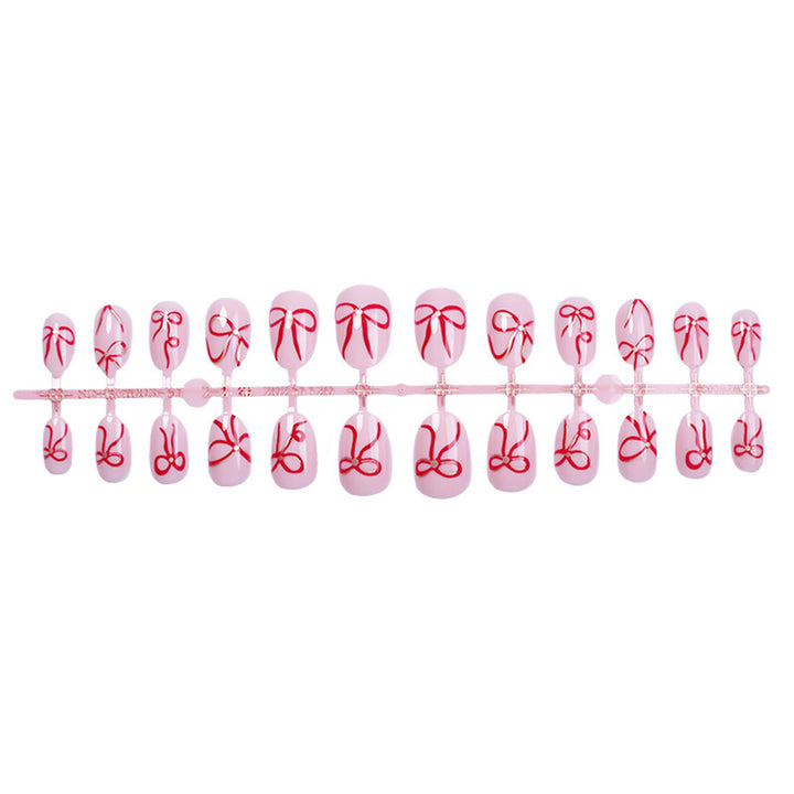 Artificial nail design with bow motifs Stornfield