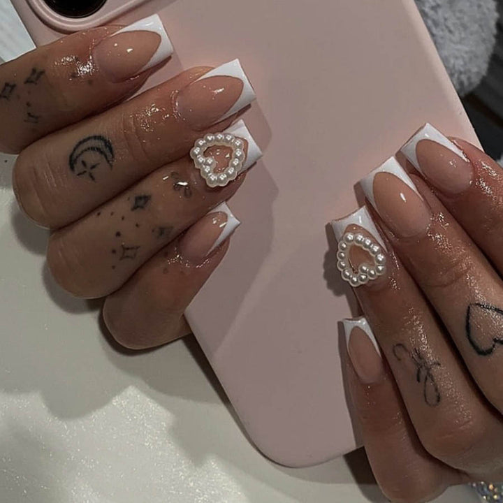 Artificial nails with elegant heart decorations Stornfield