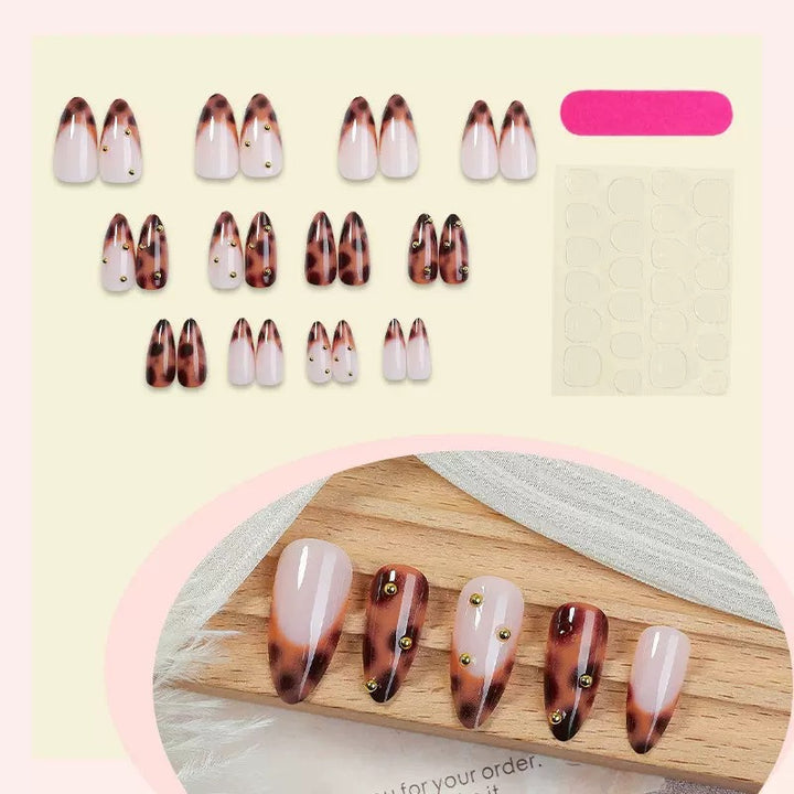 Acrylic nail set with luxurious leopard pattern and golden accents Stornfield