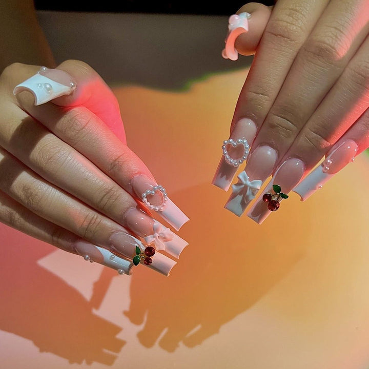 Artificial nail set with elegant 3D decorations and pearl accents Stornfield