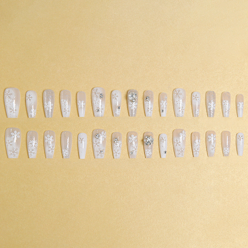 Artificial nail set with frosty snowflake design and sparkling 3D applications Stornfield