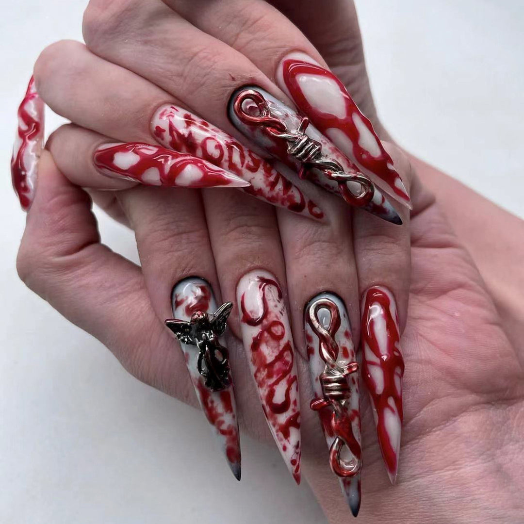 Creative Stiletto Nail Art with Blood Red Accents Stornfield