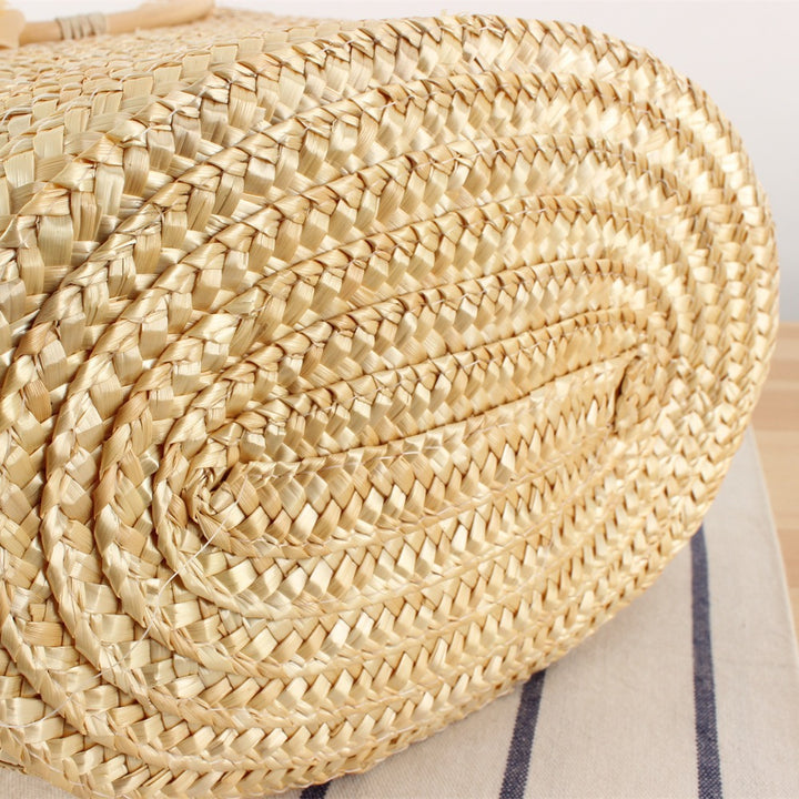 Braided straw bag with floral accent Stornfield