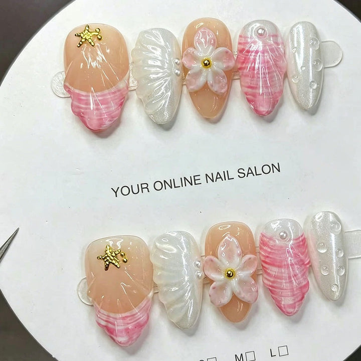 Art nail set with elegant floral decorations and glitter accents Stornfield