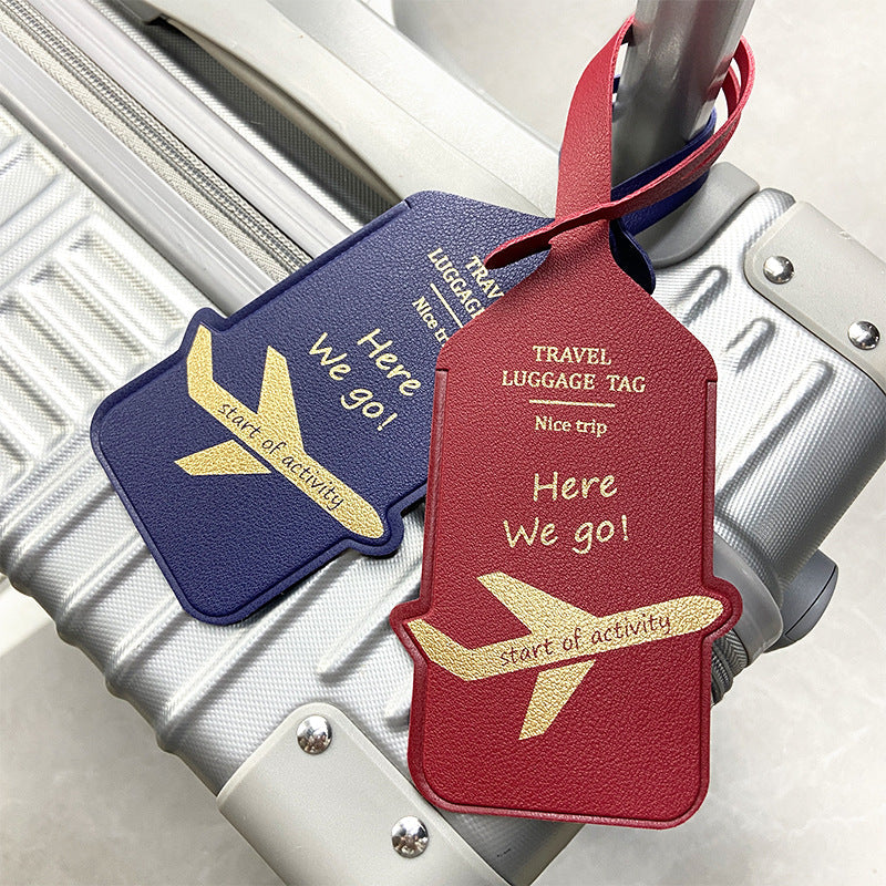 premium leather travel luggage ID tag with embossed airplane motif and adjustable strap Stornfield