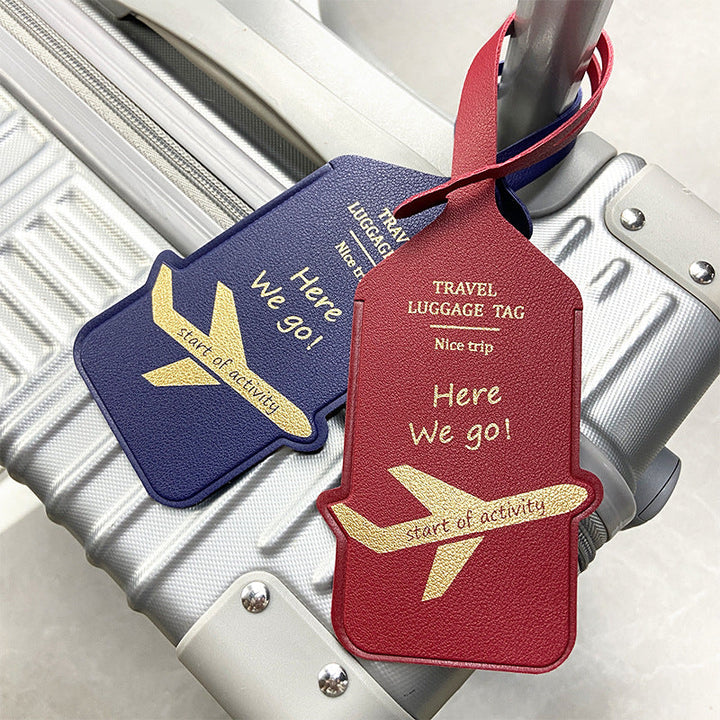 premium leather travel luggage ID tag with embossed airplane motif and adjustable strap Stornfield