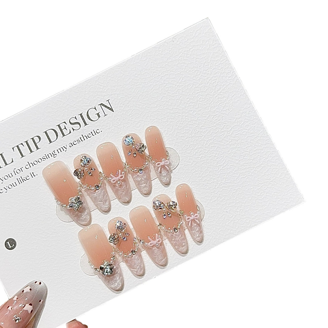 Artificial nails with romantic rhinestone details Stornfield