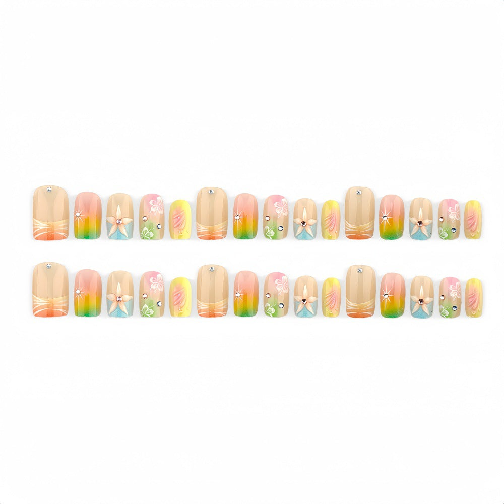 Acrylic nails with floral accents and gradient Stornfield