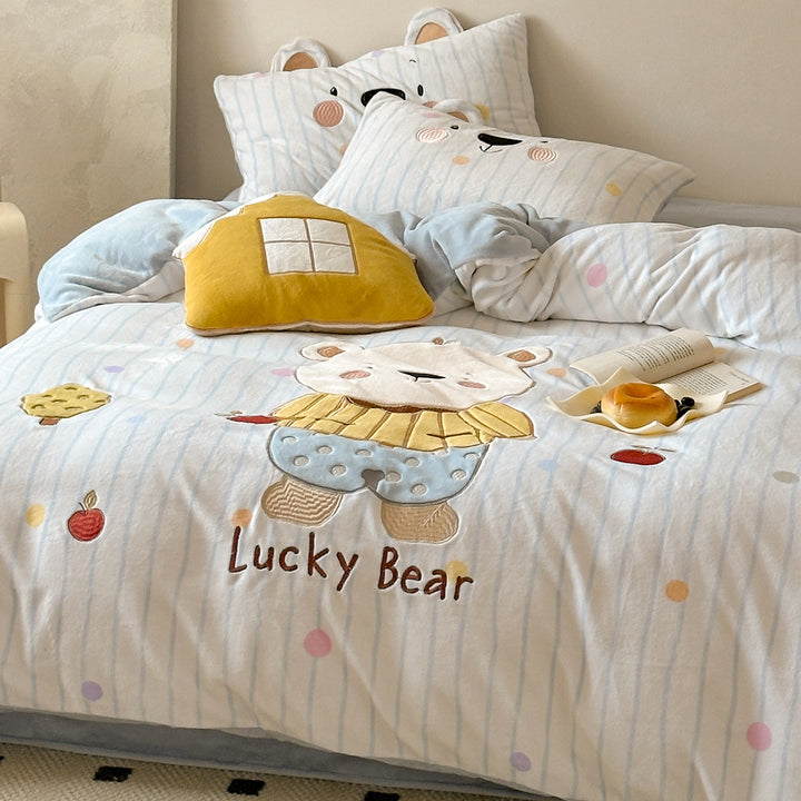 Children's bedding set with three-dimensional ear appliqué and embroidered bear motif