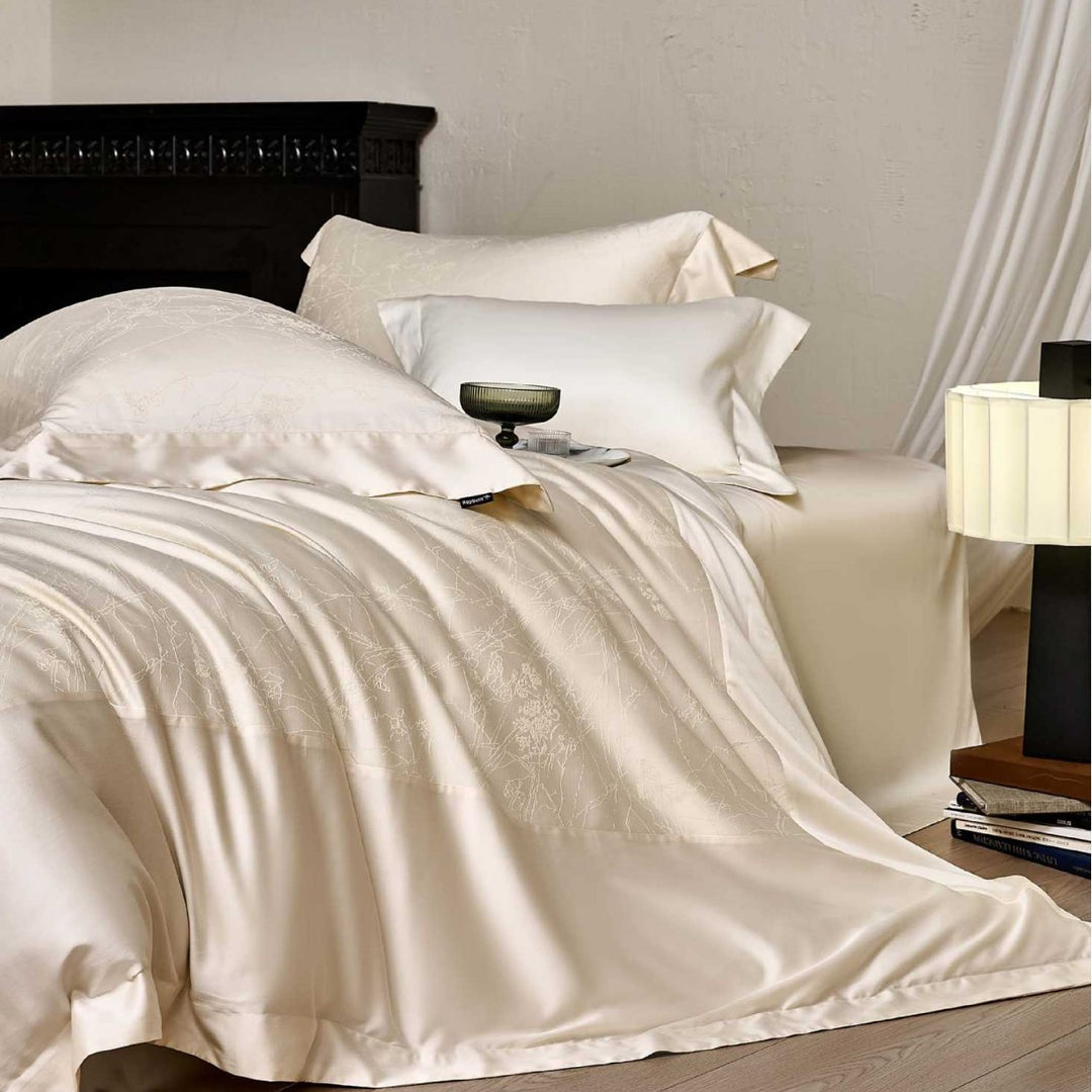 Satin bed linen set with floral jacquard texture and fine hem detail