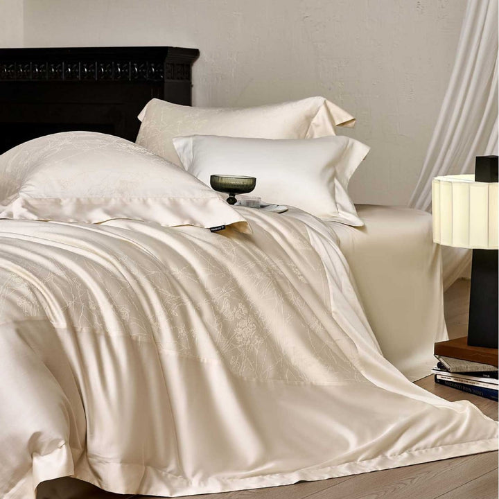 Satin bed linen set with floral jacquard texture and fine hem detail