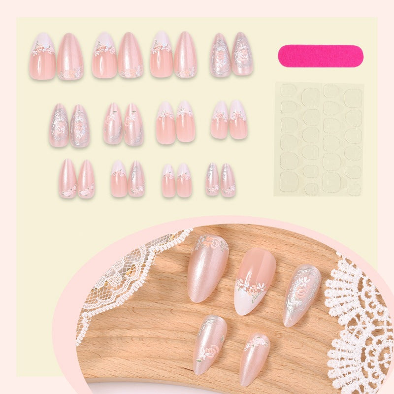 Acrylic nail set with elegant floral and glitter motifs Stornfield