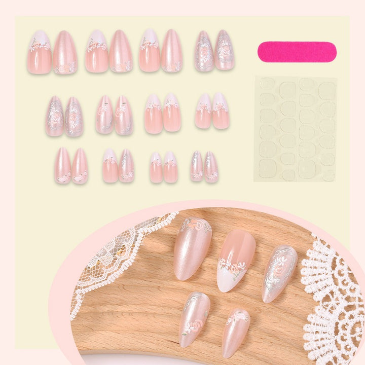 Acrylic nail set with elegant floral and glitter motifs Stornfield
