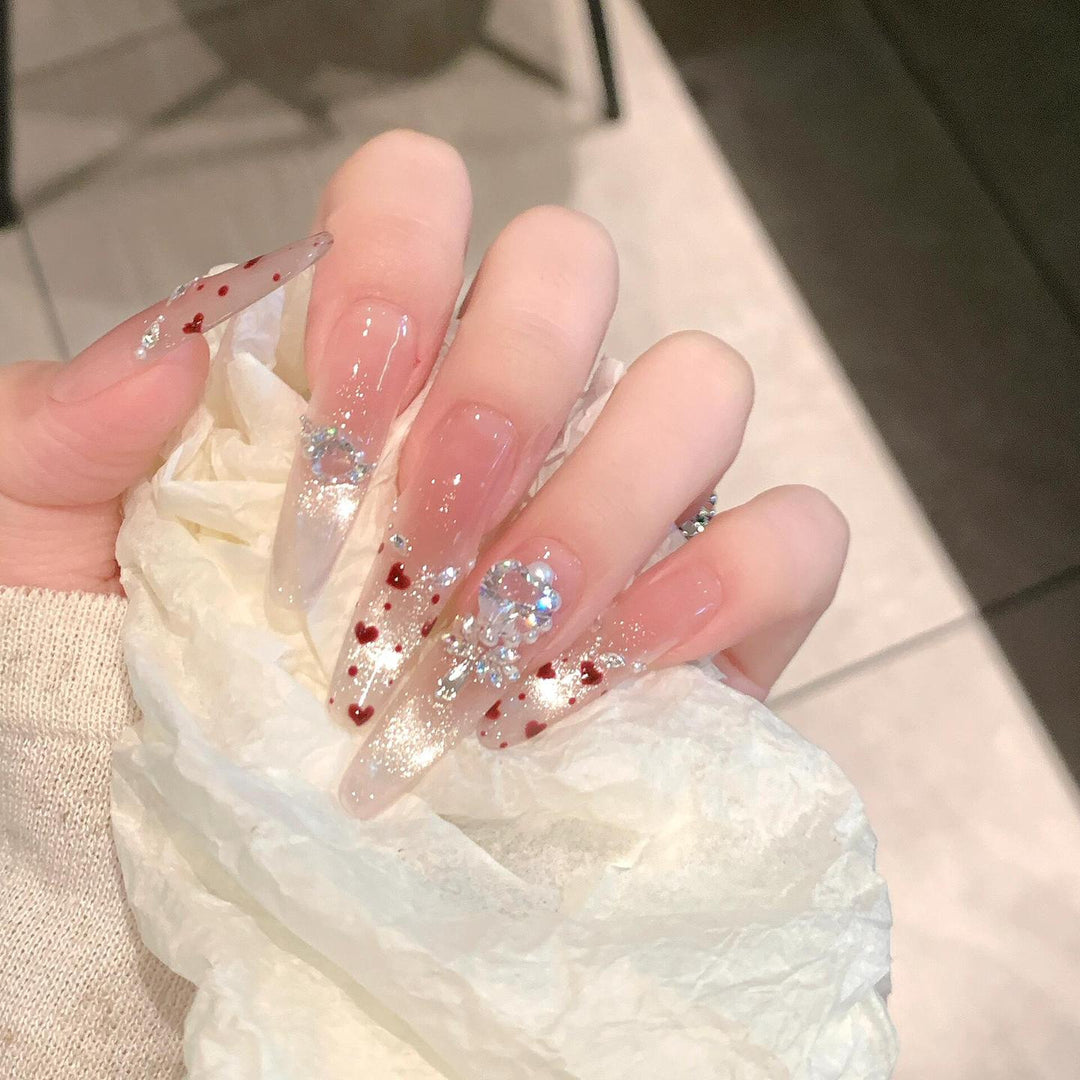 Nail art set with sparkling rhinestones and heart design Stornfield