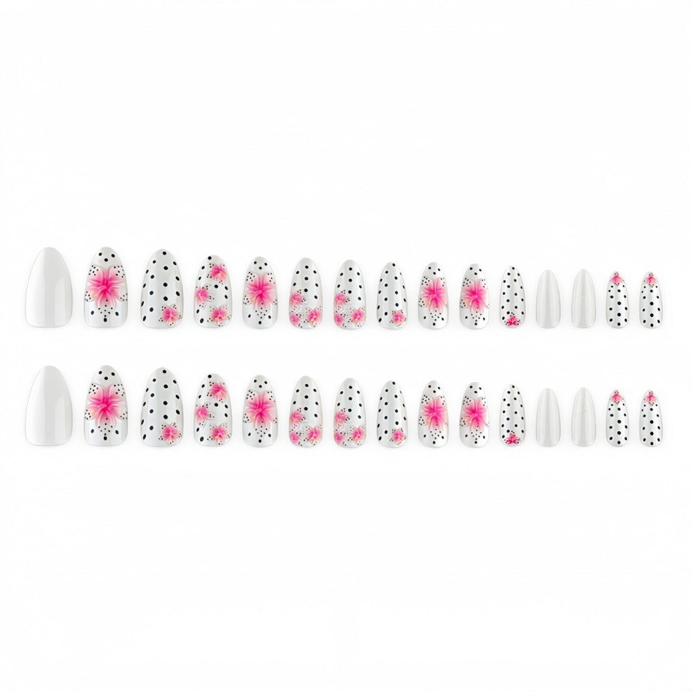 Artificial nail set with floral accents and polka dots Stornfield