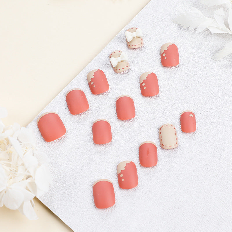 Artistic nail nails with decorative bow designs and French tips Stornfield