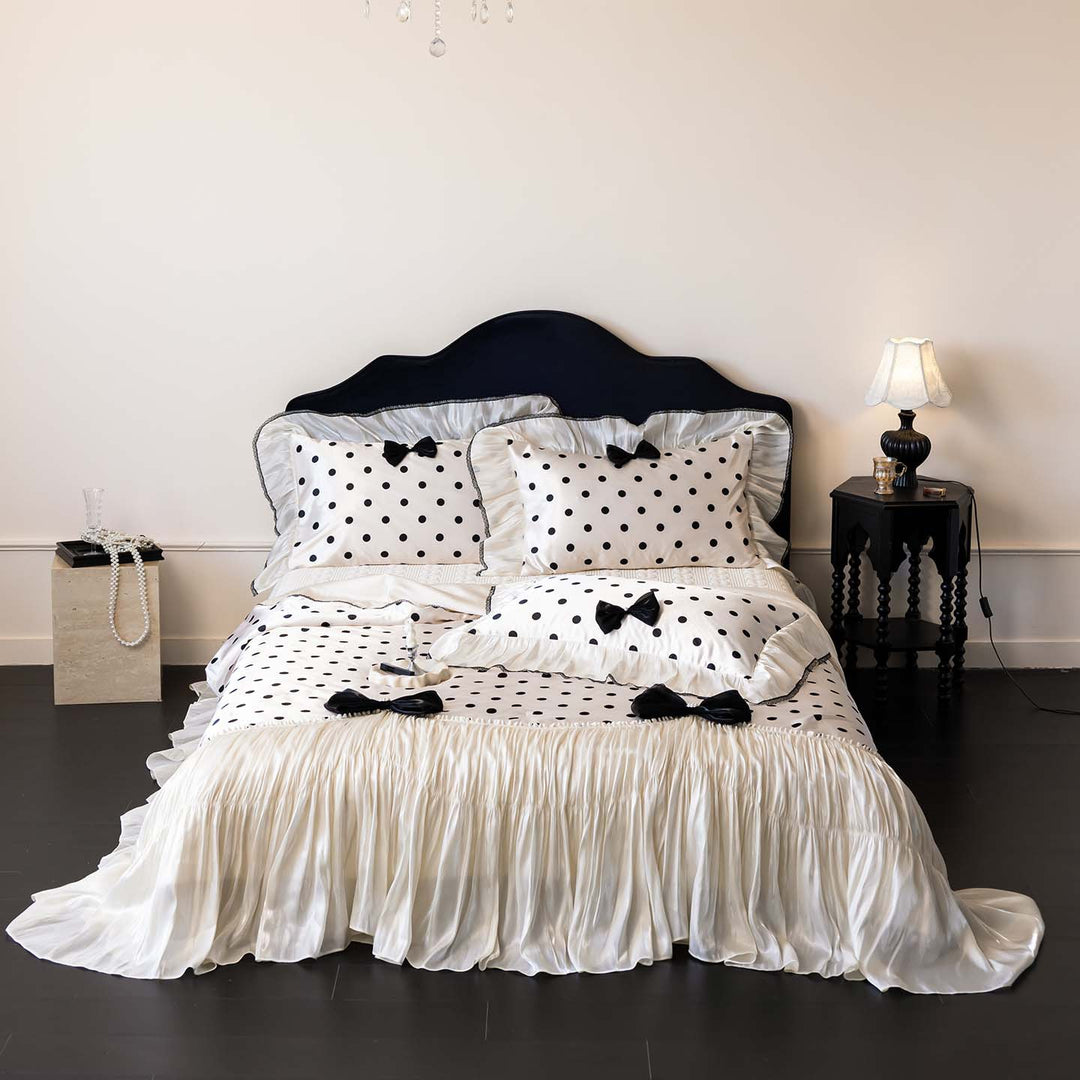 Romantic polka dot satin bedding set with ruffles and decorative ribbons