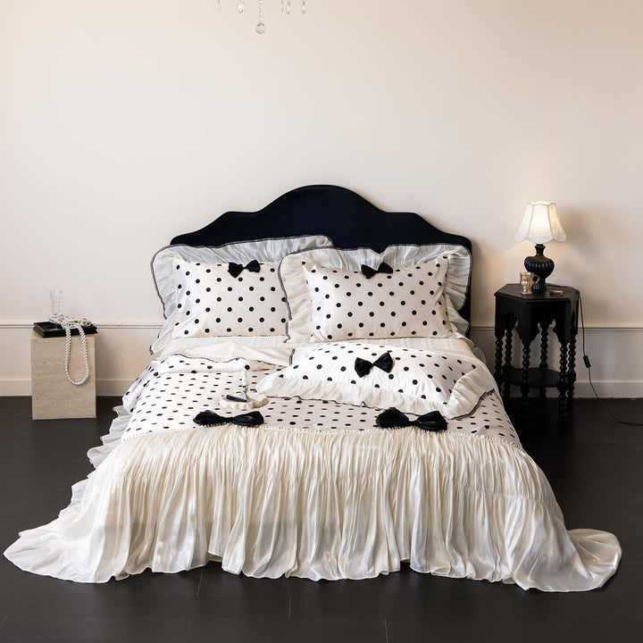 Romantic polka dot satin bedding set with ruffles and decorative ribbons