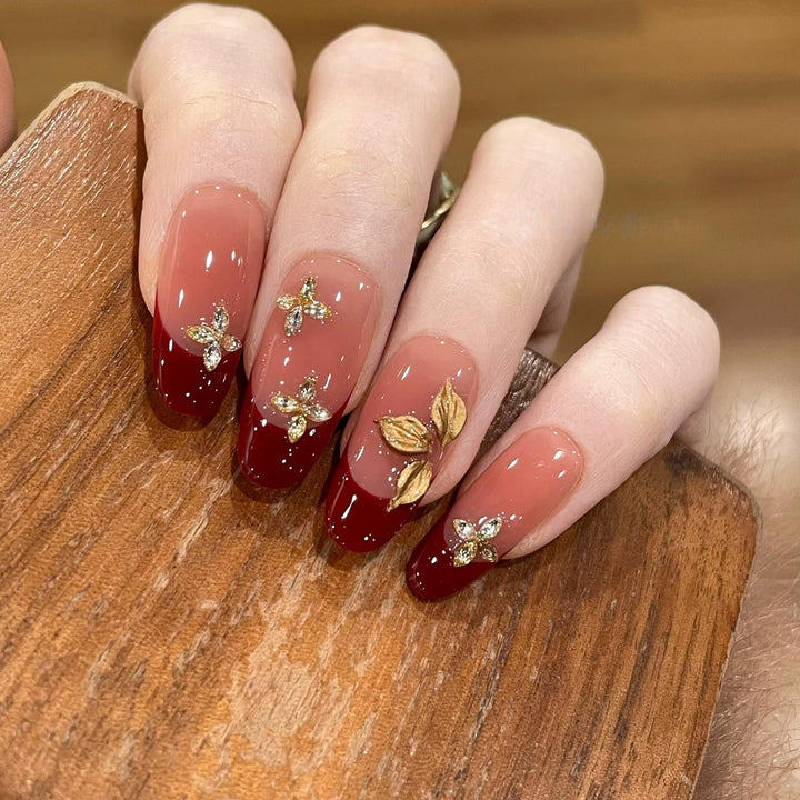 Artificial nails with luxurious flower and glitter elements Stornfield
