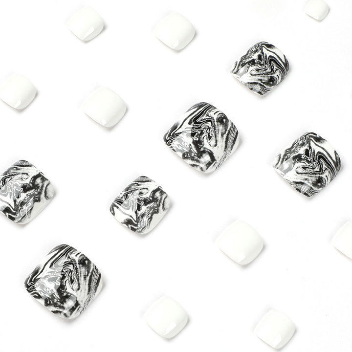 Artful toenail art in elegant marble design Stornfield