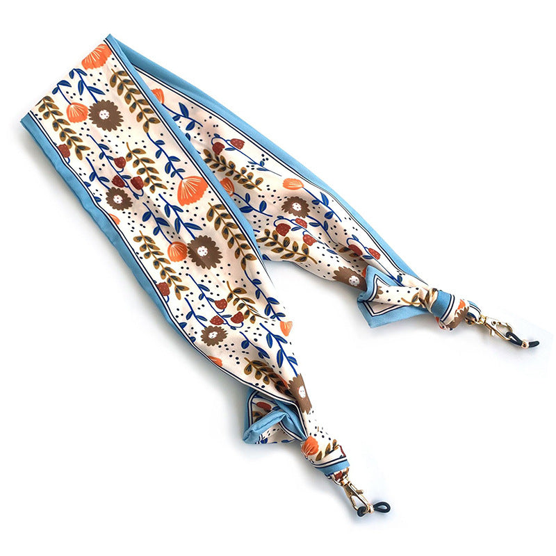 Fashionable fabric mask holder with floral motifs Stornfield