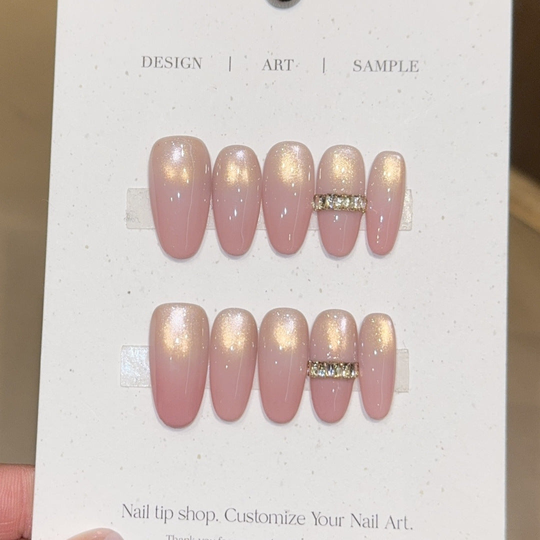 Glamorous artificial nails with elegant glitter and rhinestone application Stornfield