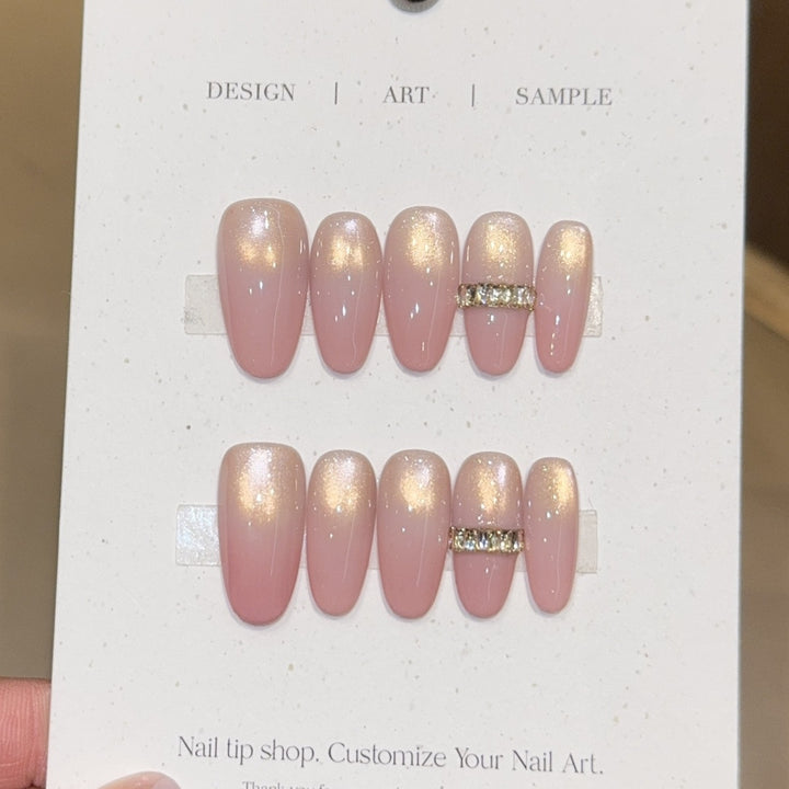Glamorous artificial nails with elegant glitter and rhinestone application Stornfield