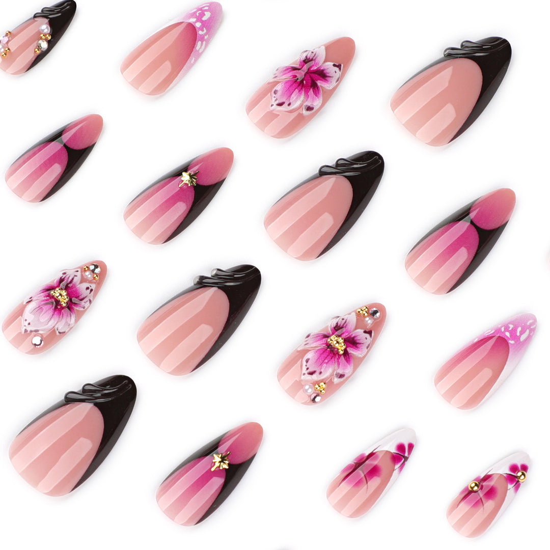 Artful stiletto nails with blooming design and glitter accents Stornfield
