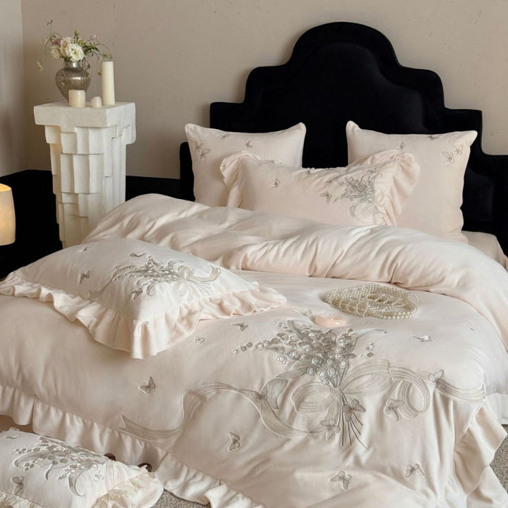 Luxurious bedding set with ruffles and floral embroidery
