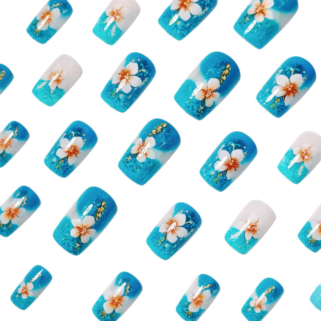 Artificial nails with floral accents and glitter patterns Stornfield