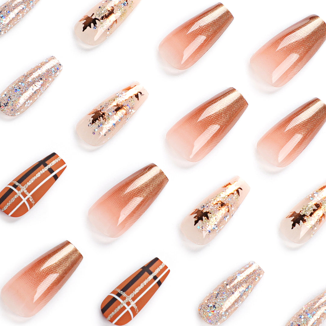 Artful nail extensions with glitter and leaf patterns Stornfield
