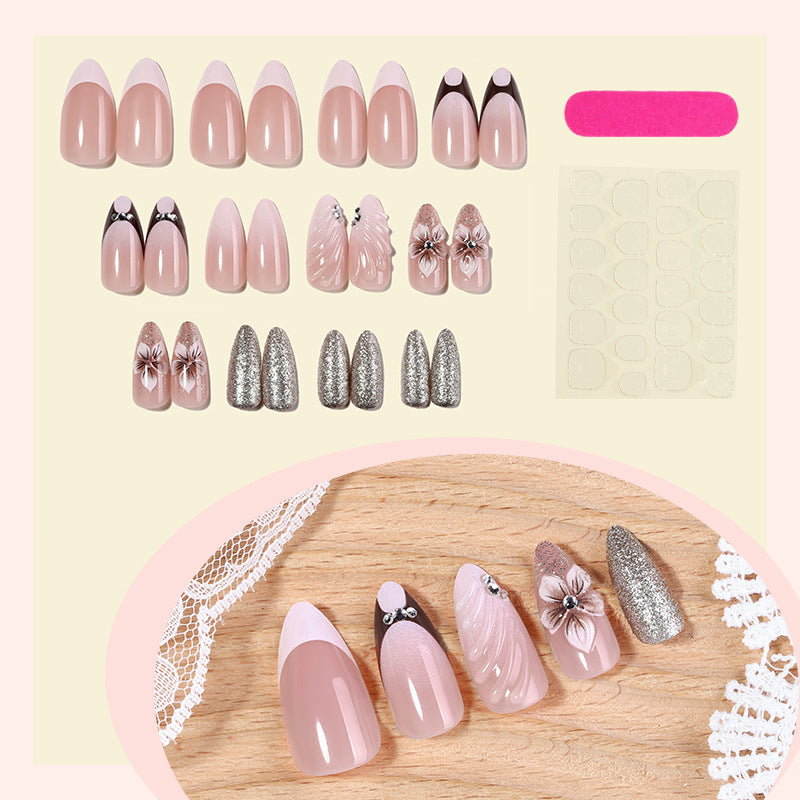 Artificial nail set with elegant flower and glitter accents Stornfield