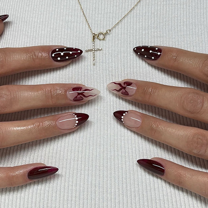 Elegantly designed stiletto nails with artistic accents Stornfield