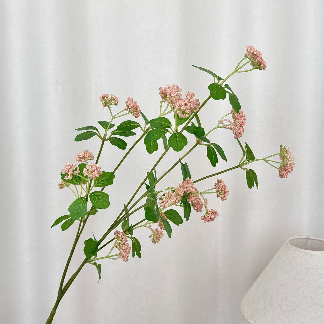 Artificial blossom branch with purple flowers