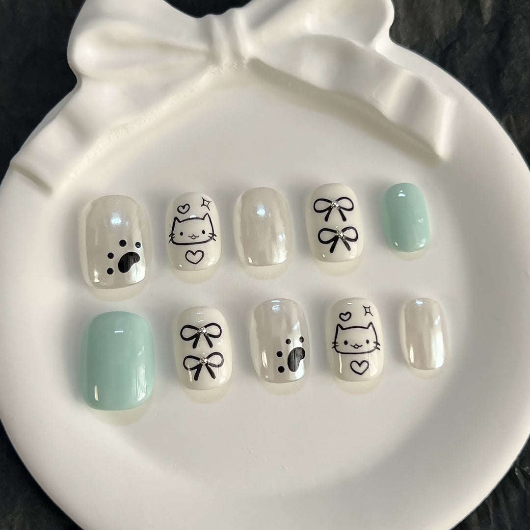 Whimsical Animal-Themed Press-On Nail Art Stornfield